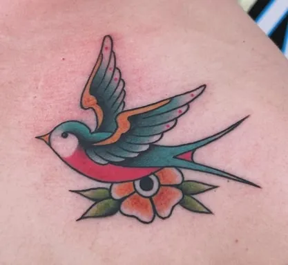 sparrows on chest tattoo